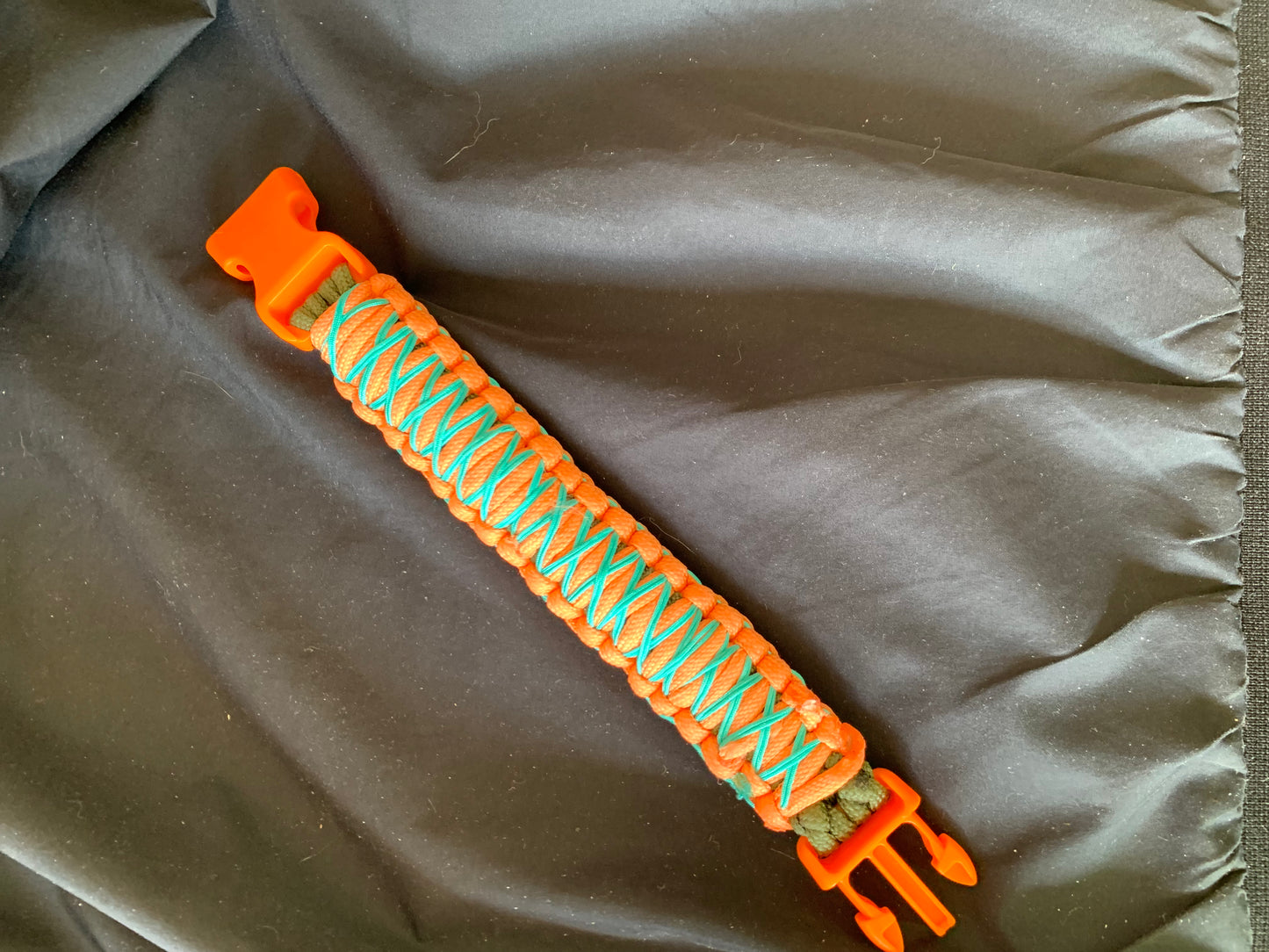 Paracord Bracelet Orange/Black Light Blue Stiched Orange Plastic Buckle 8"