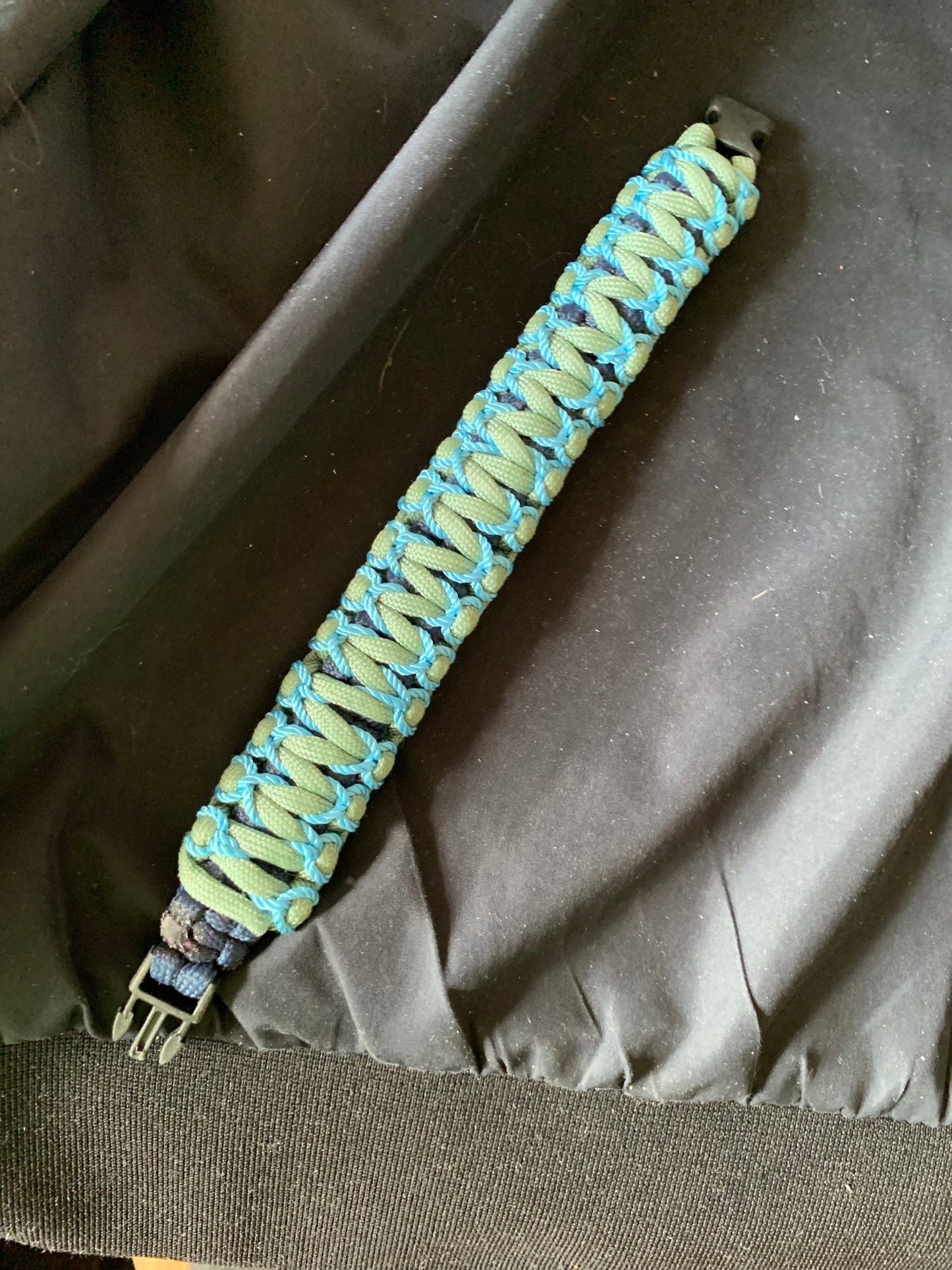Paracord Bracelet Gray/Black with Light Blue Stiches Plastic Buckle 8"